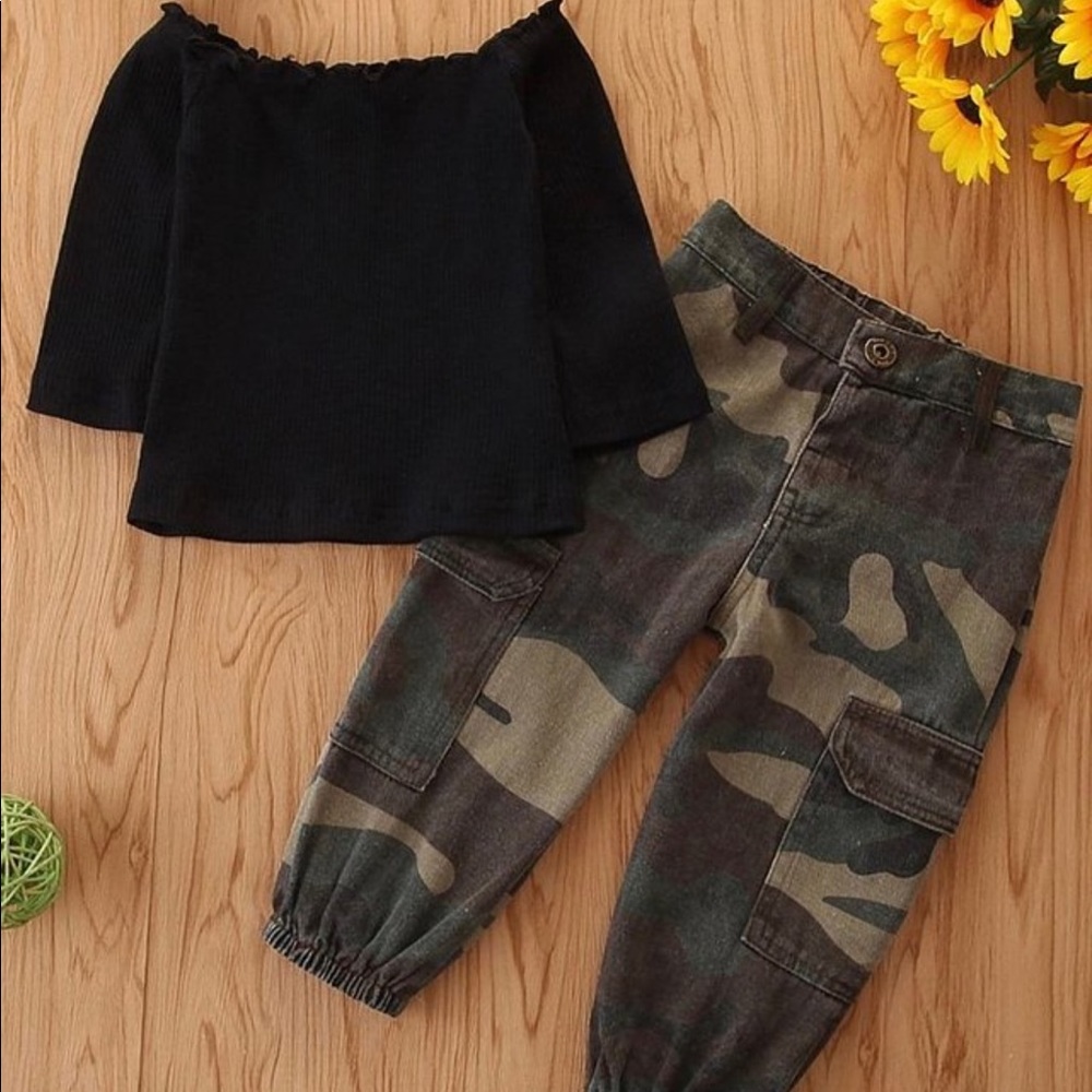 Black top with camo pants